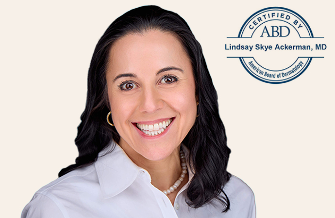 Professional headshot of Dr. Lindsay Skye Ackerman, smiling, dressed in a white coat, with the 'Certified by ABD' seal in the background. 